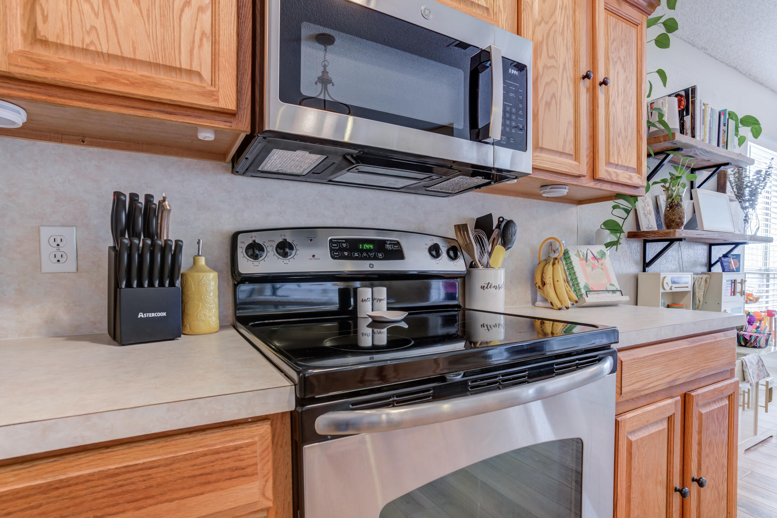 1607 79th Street Lubbock, TX 79423 - Photo 20 of 53 a kitchen with stainless steel appliances granite countertop a sink and a stove