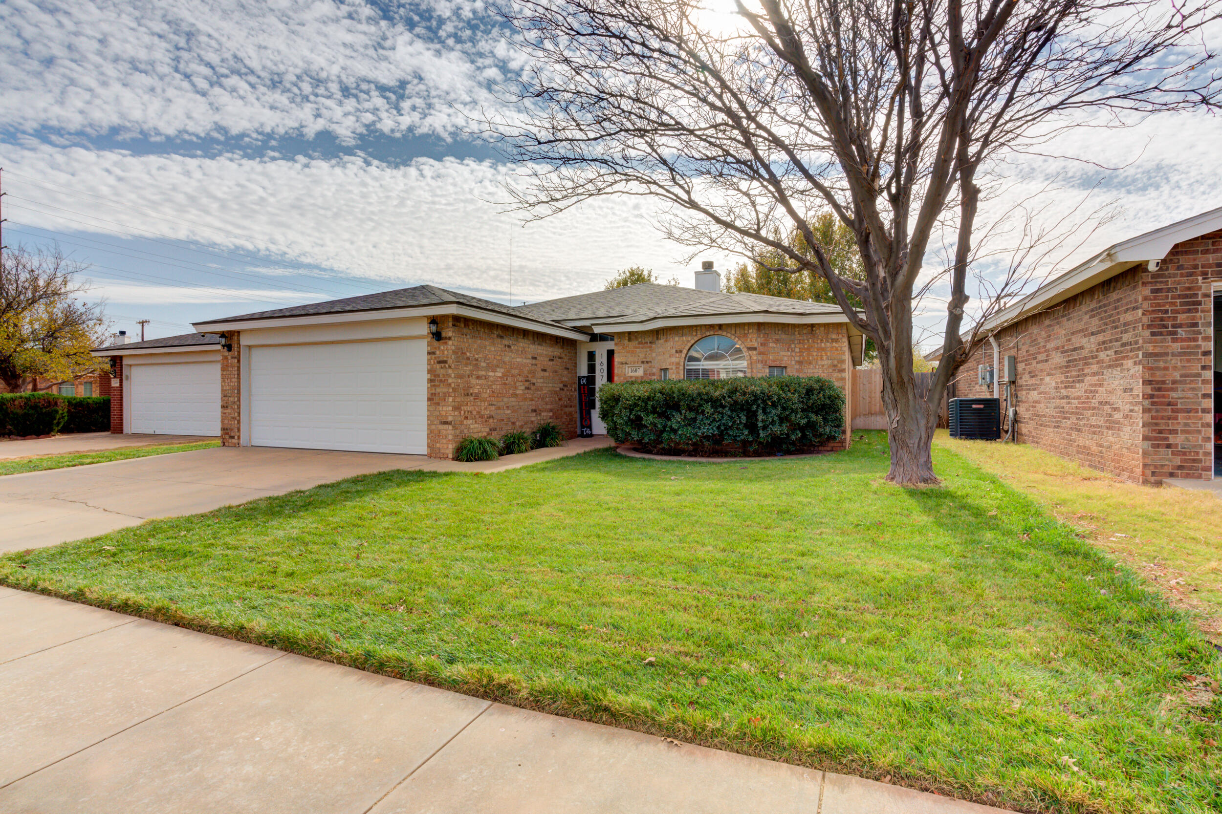 1607 79th Street Lubbock, TX 79423 - Photo 2 of 53 a front view of house with yard