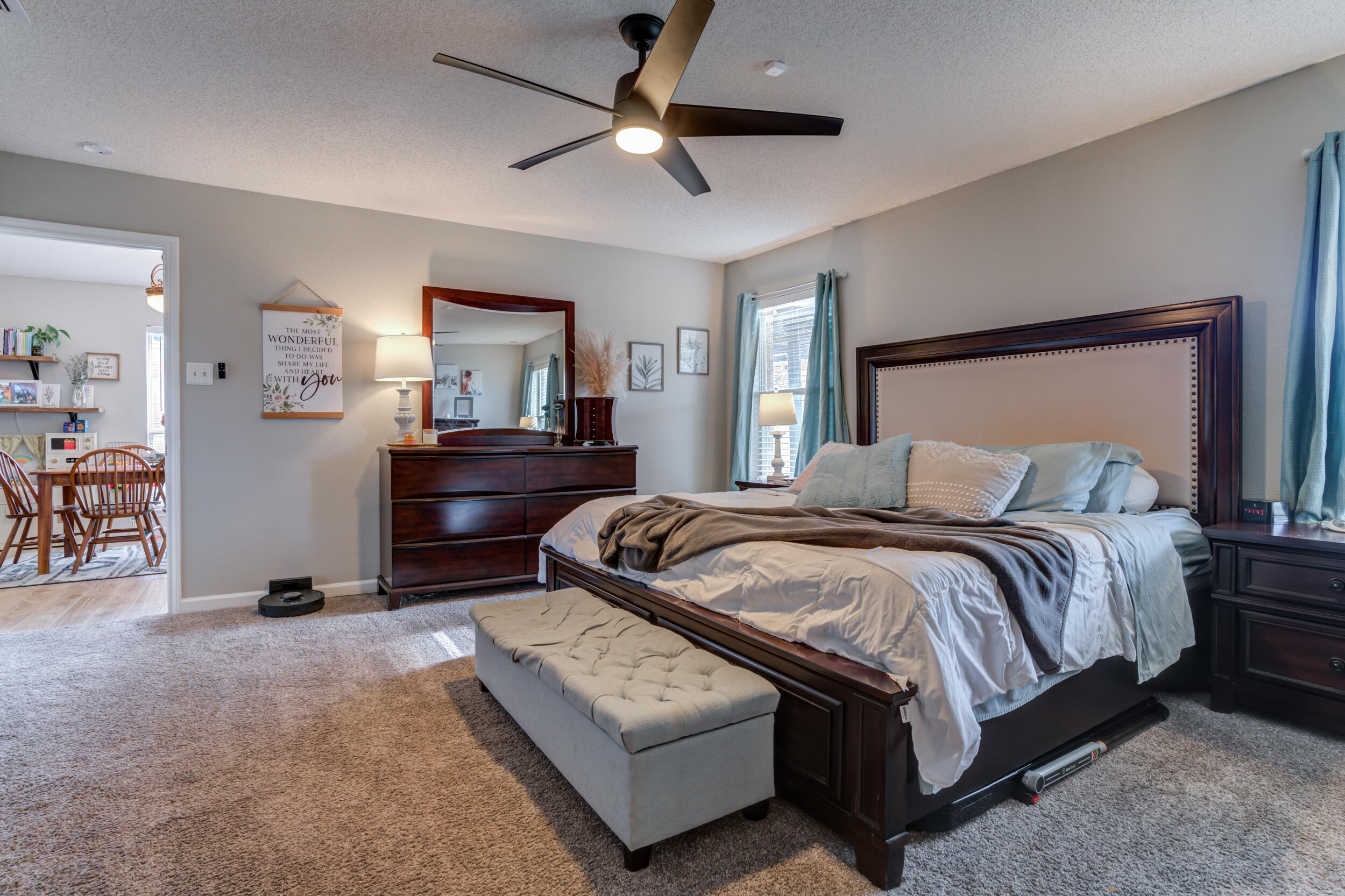1607 79th Street Lubbock, TX 79423 - Photo 30 of 53 a bedroom with a bed window and a table