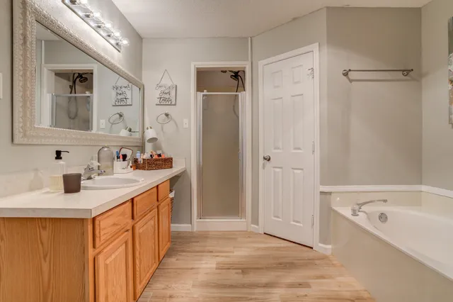 a bathroom with a sink double vanity and a mirror