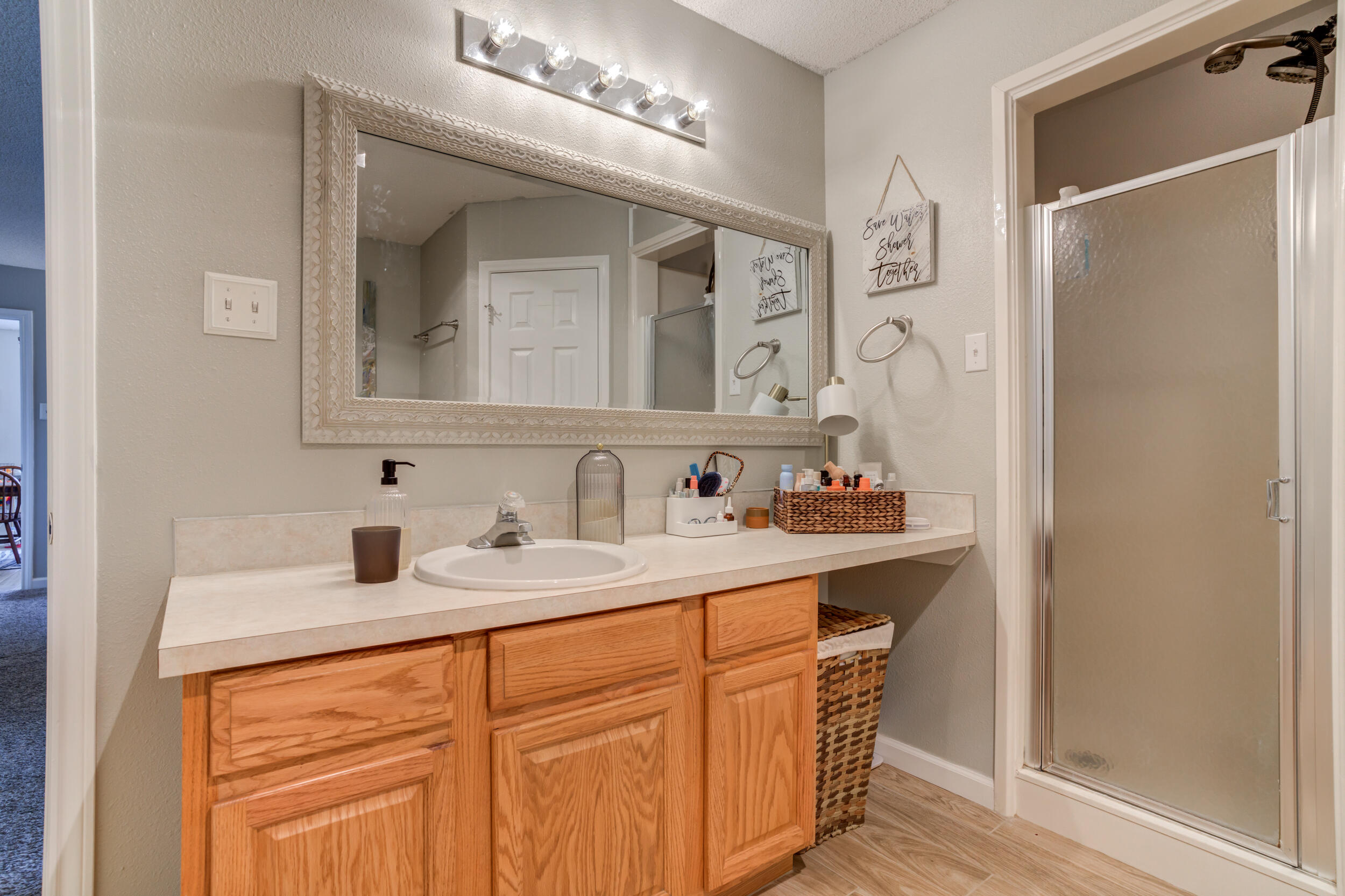 1607 79th Street Lubbock, TX 79423 - Photo 34 of 53 a bathroom with a sink double vanity and a mirror