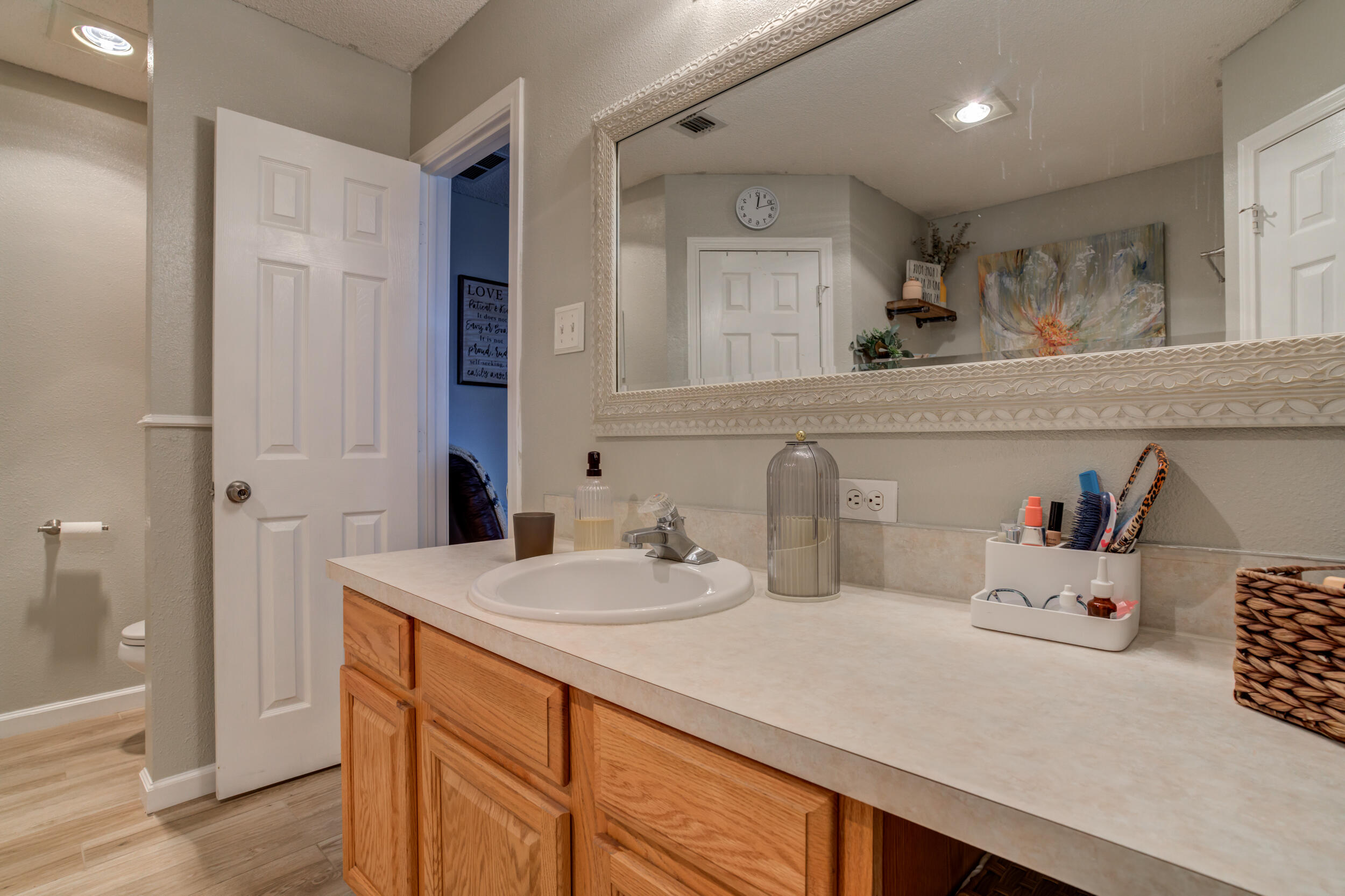 1607 79th Street Lubbock, TX 79423 - Photo 36 of 53 a bathroom with a sink and a mirror