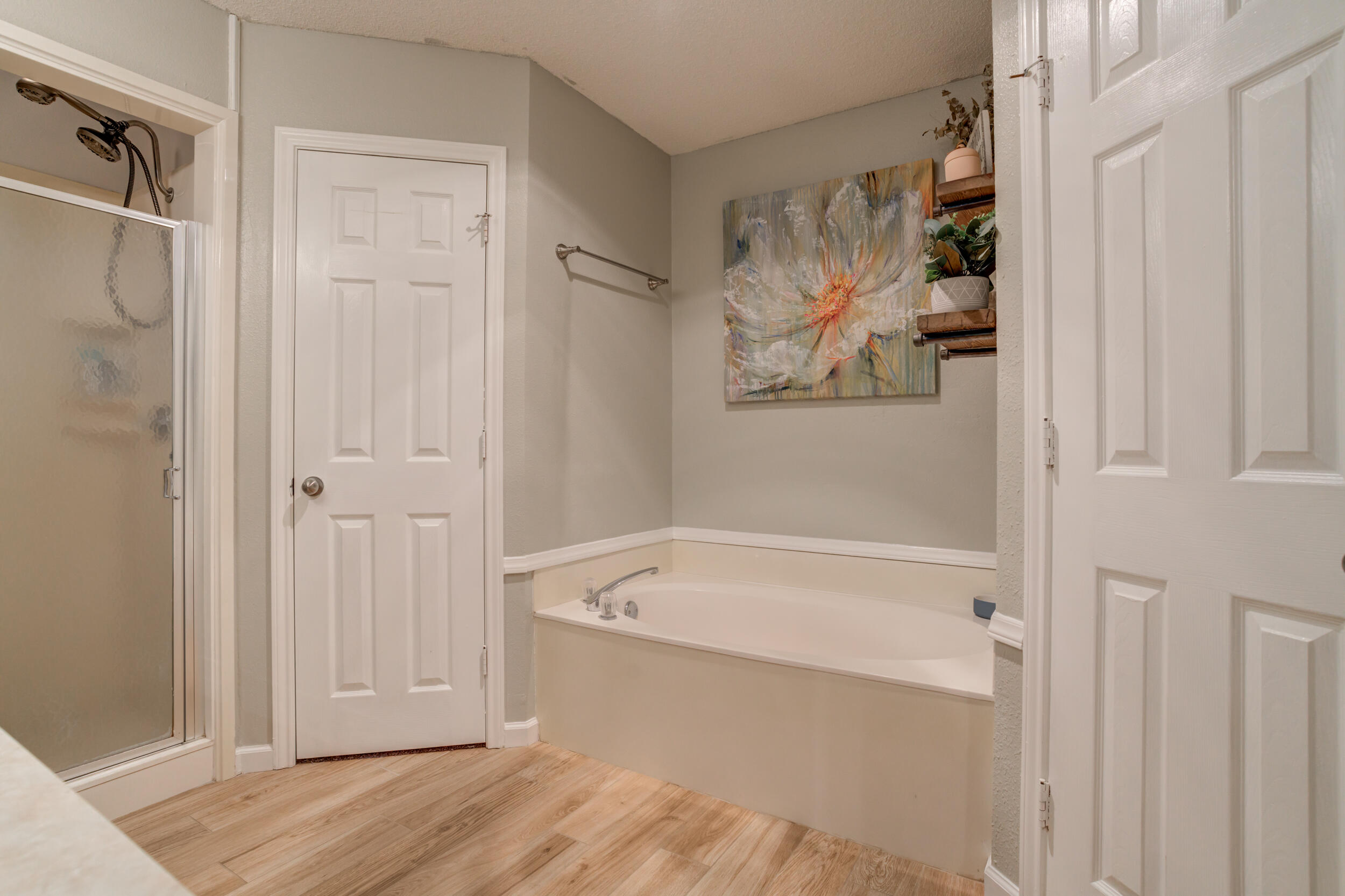 1607 79th Street Lubbock, TX 79423 - Photo 37 of 53 a bathroom with a bathtub and a shower