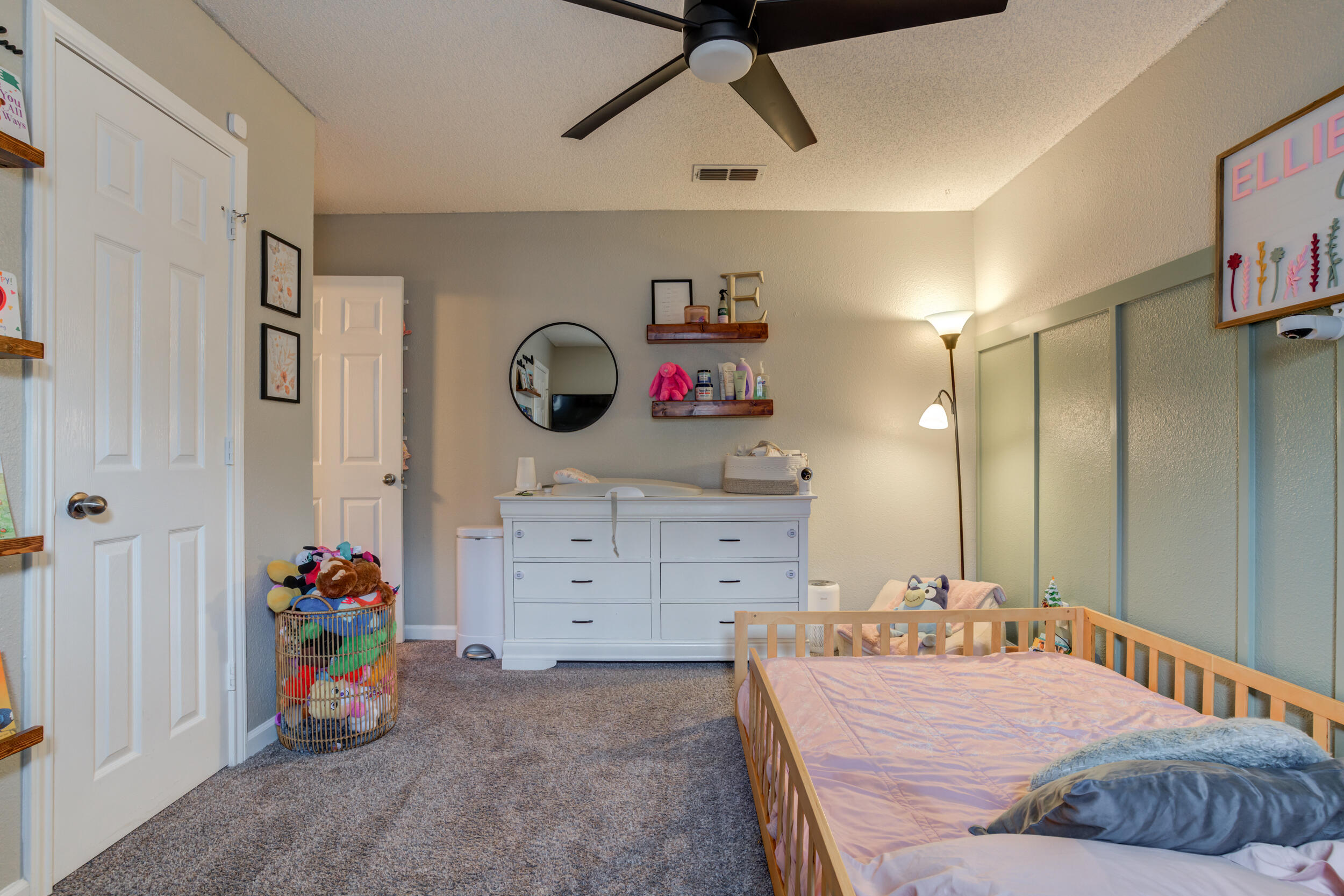 1607 79th Street Lubbock, TX 79423 - Photo 41 of 53 a bedroom with a bed and a dresser