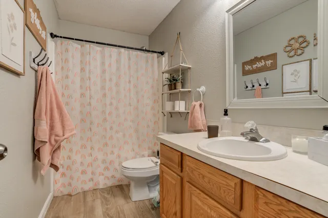 a utility room with cabinets washer and dryer