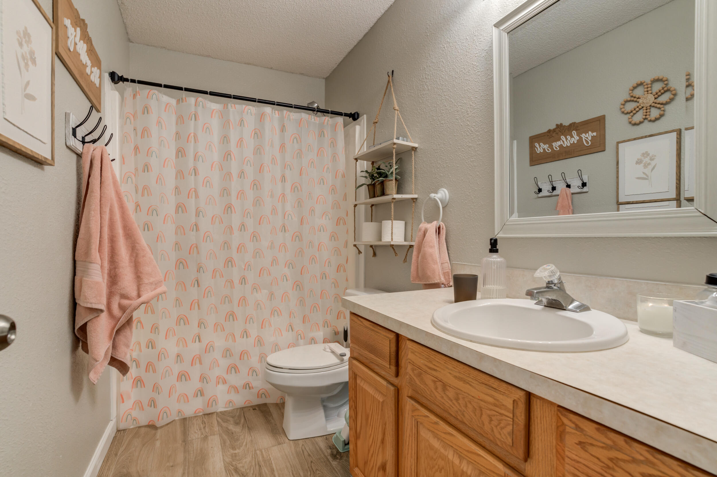 1607 79th Street Lubbock, TX 79423 - Photo 43 of 53 a bathroom with a sink toilet and shower