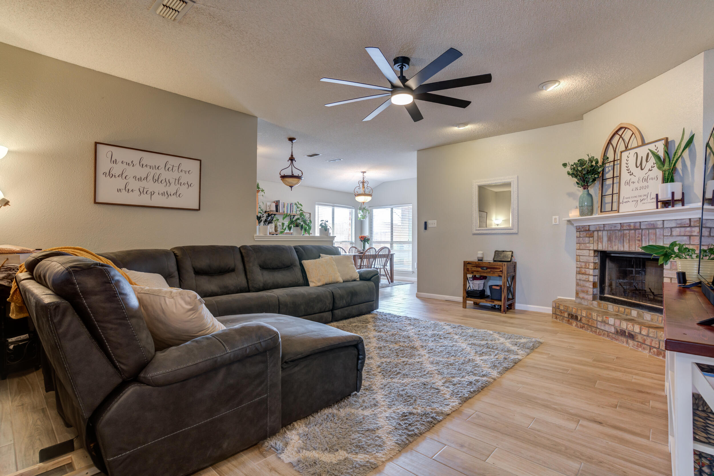 1607 79th Street Lubbock, TX 79423 - Photo 5 of 53 a view of a livingroom with furniture and a fireplace