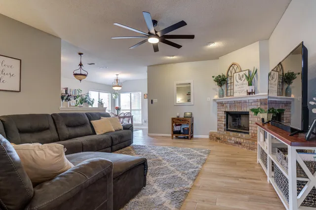 a living room with furniture and a fireplace