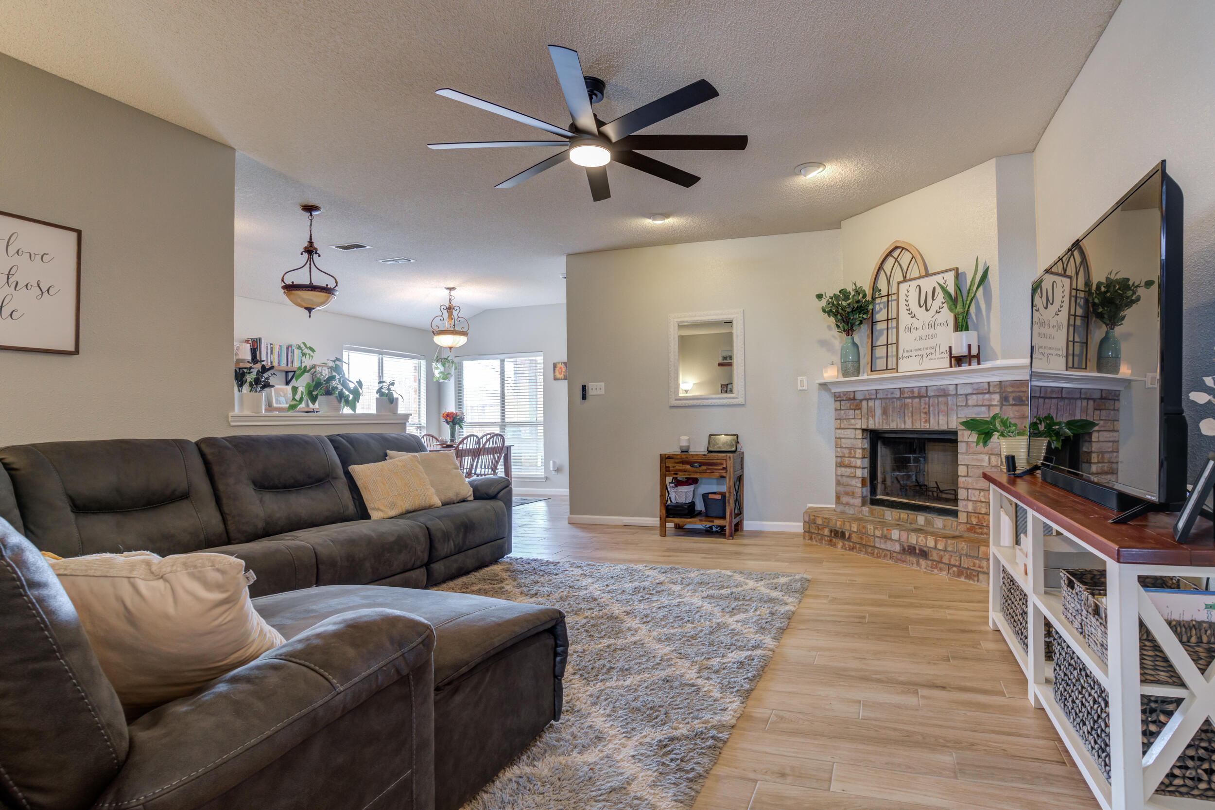 1607 79th Street Lubbock, TX 79423 - Photo 6 of 53 a living room with furniture and a fireplace