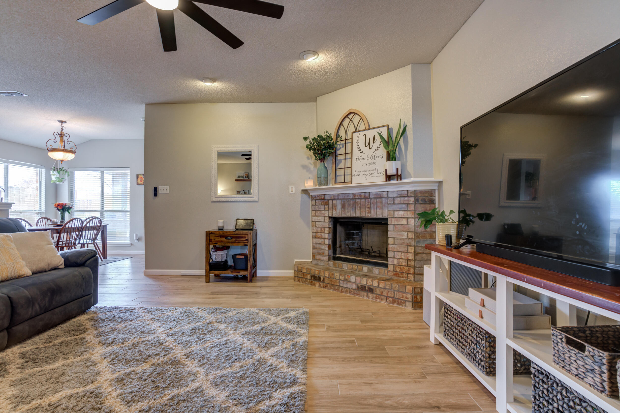 1607 79th Street Lubbock, TX 79423 - Photo 7 of 53 a living room with furniture and a fireplace