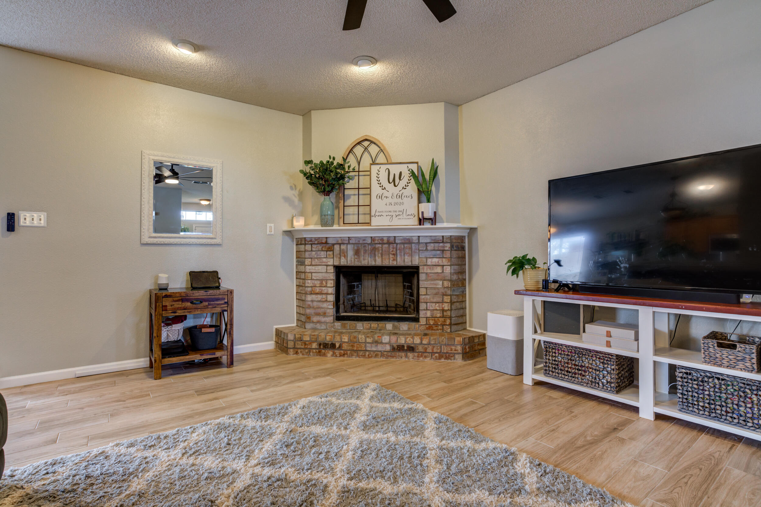 1607 79th Street Lubbock, TX 79423 - Photo 8 of 53 a living room with furniture and a fireplace