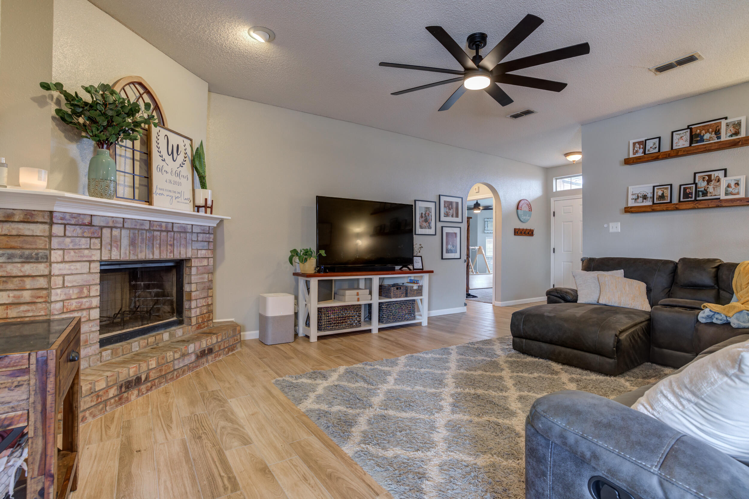 1607 79th Street Lubbock, TX 79423 - Photo 10 of 53 a living room with furniture and a flat screen tv