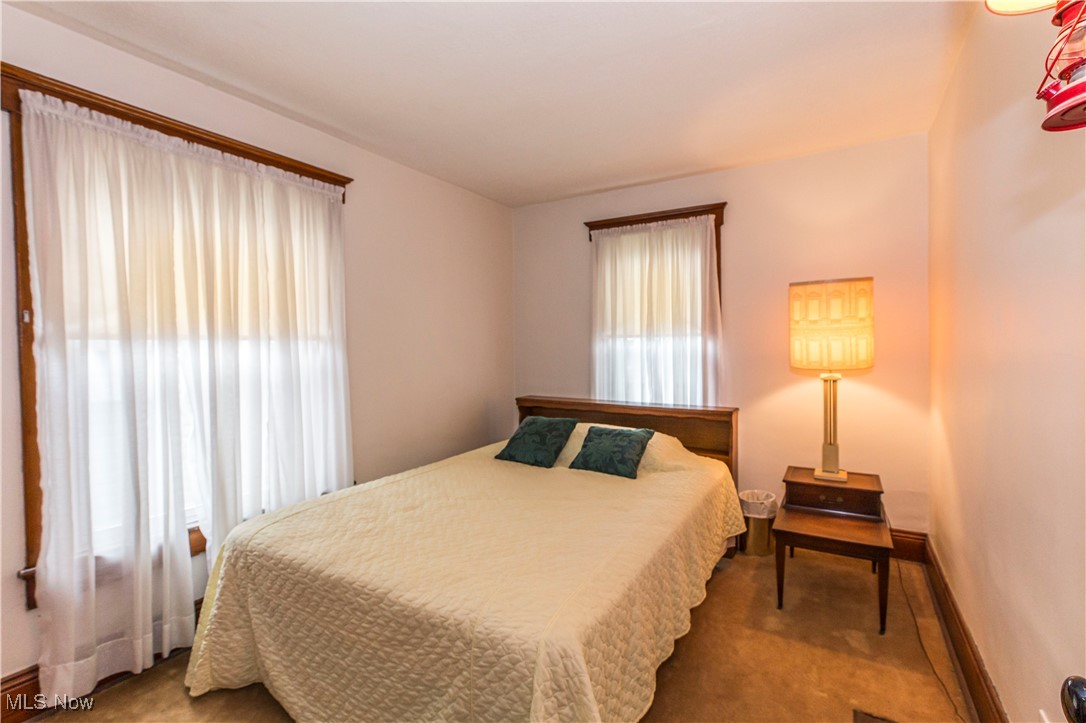 749 Amherst Road Northeast Massillon, OH 44646 - Photo 30 of 41 Carpeted bedroom featuring multiple windows