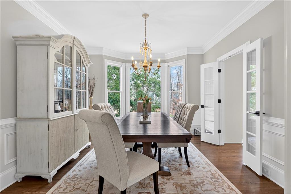 14325 Morning Mountain Way Milton, GA 30004 - Photo 18 of 66 a view of a dining room with furniture window and wooden floor