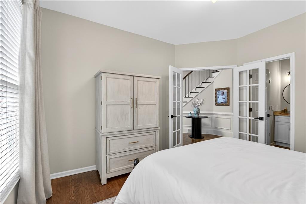 14325 Morning Mountain Way Milton, GA 30004 - Photo 23 of 66 a bedroom with a bed and a closet