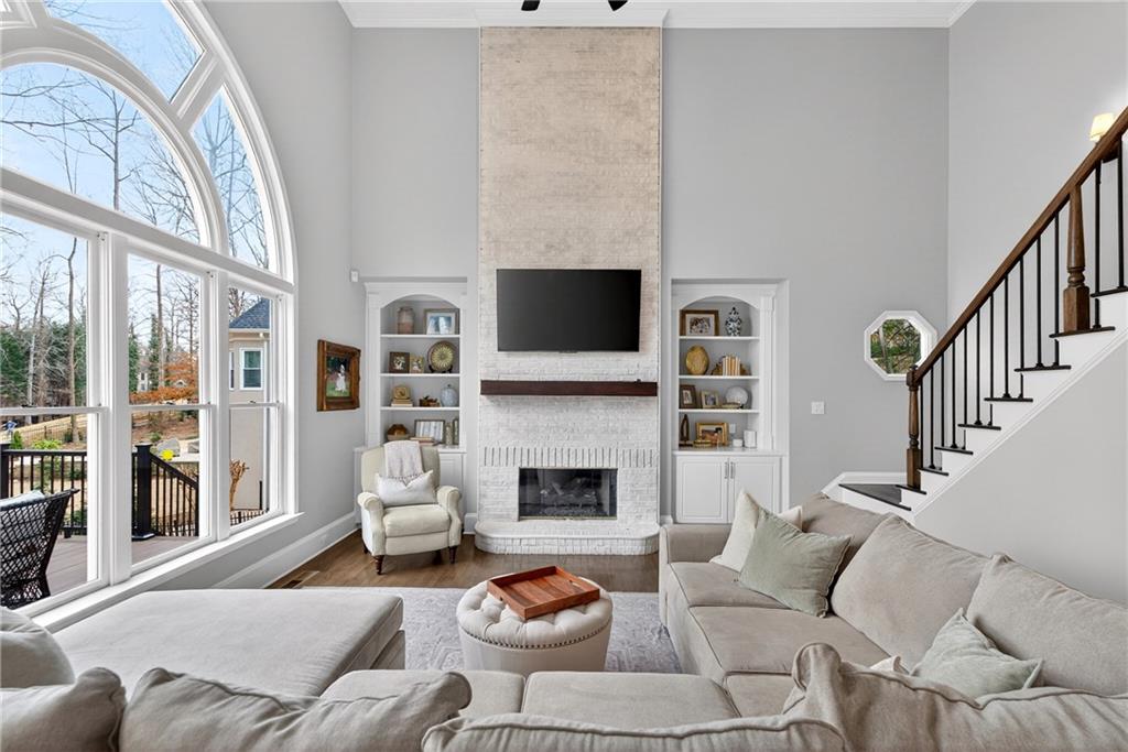 14325 Morning Mountain Way Milton, GA 30004 - Photo 3 of 66 a living room with fireplace furniture and a flat screen tv