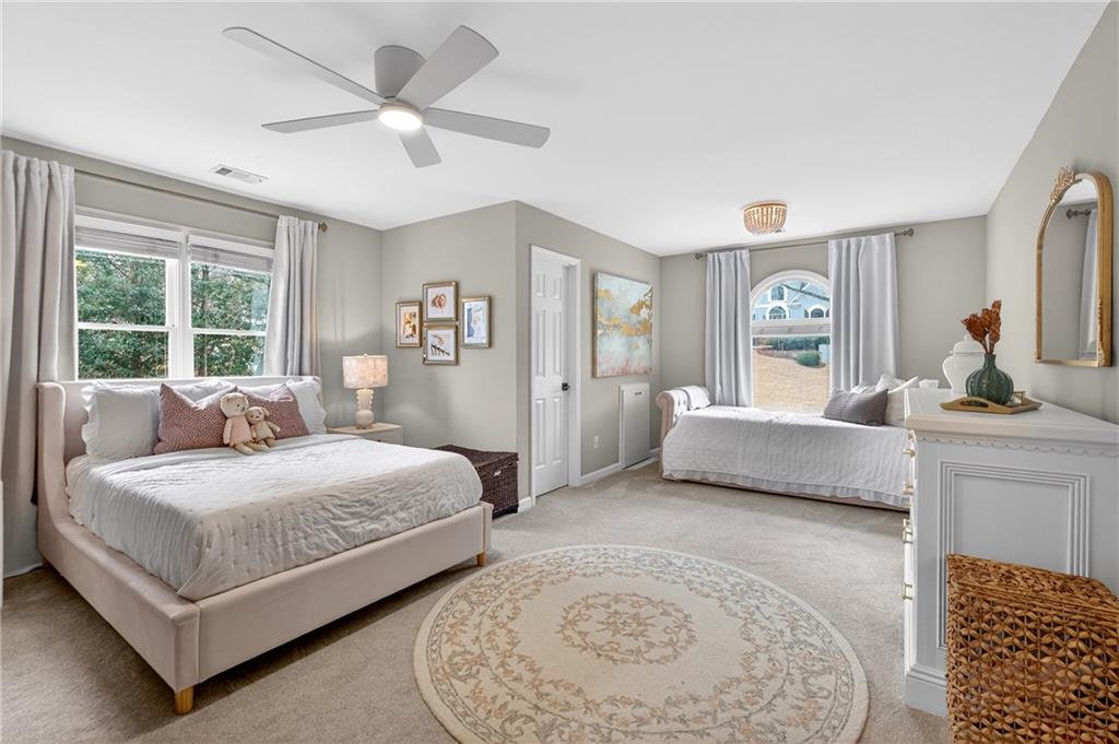 14325 Morning Mountain Way Milton, GA 30004 - Photo 32 of 66 a bedroom with a bed and window