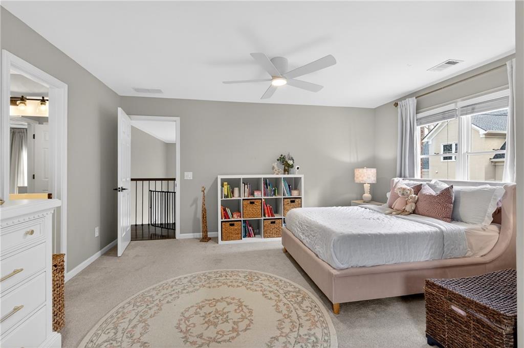 14325 Morning Mountain Way Milton, GA 30004 - Photo 33 of 66 a bedroom with a bed and a cabinets