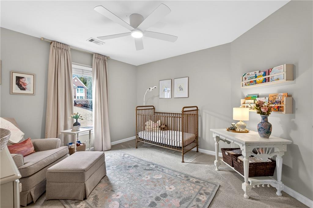 14325 Morning Mountain Way Milton, GA 30004 - Photo 35 of 66 a bedroom with furniture and a window