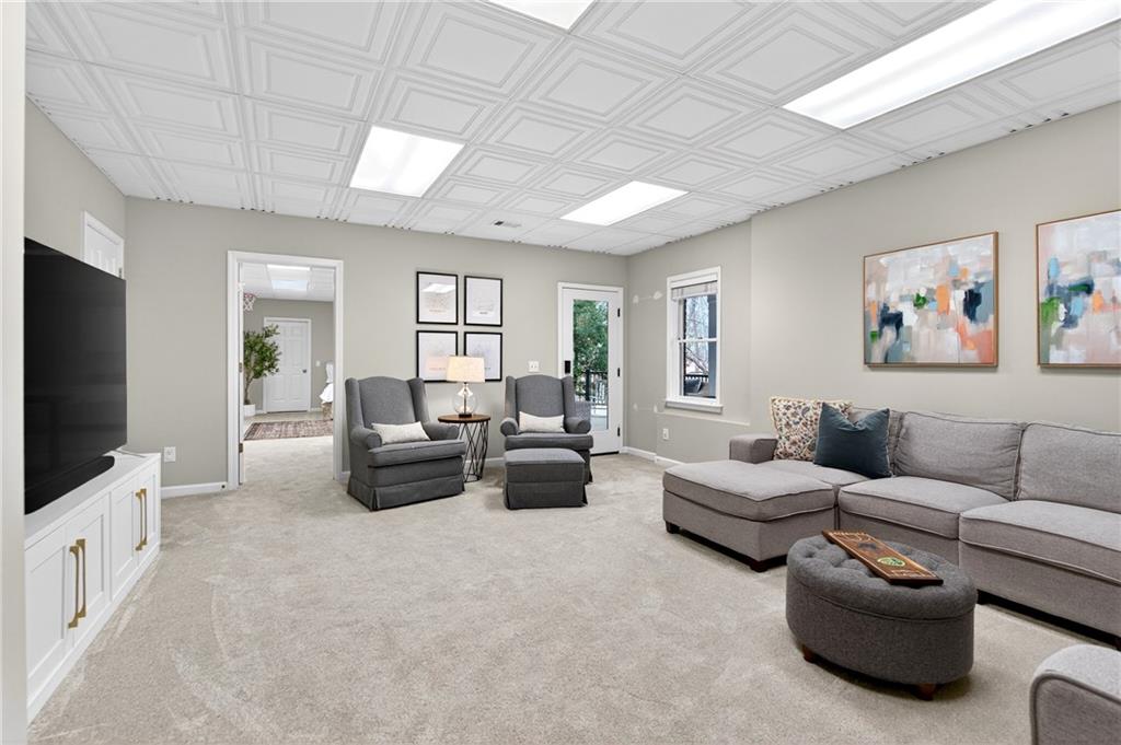 14325 Morning Mountain Way Milton, GA 30004 - Photo 39 of 66 a living room with furniture and a flat screen tv