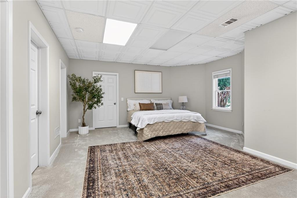 14325 Morning Mountain Way Milton, GA 30004 - Photo 40 of 66 a bedroom with a large bed and a couch