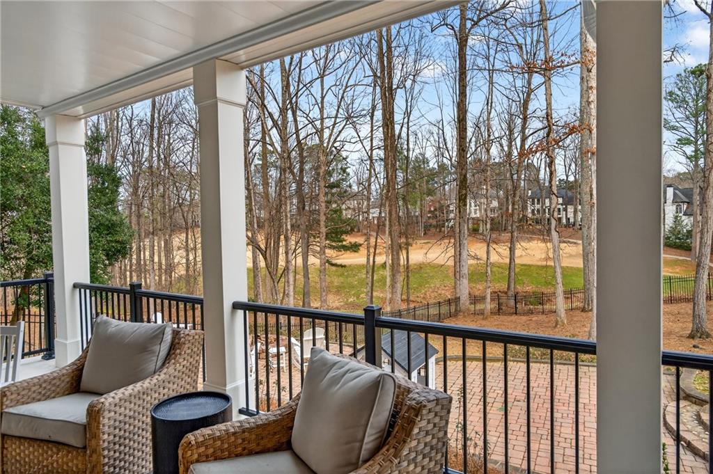 14325 Morning Mountain Way Milton, GA 30004 - Photo 47 of 66 a living room with furniture and a window