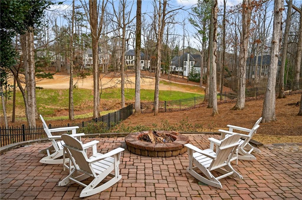 14325 Morning Mountain Way Milton, GA 30004 - Photo 50 of 66 a view of swimming pool with outdoor seating and large trees