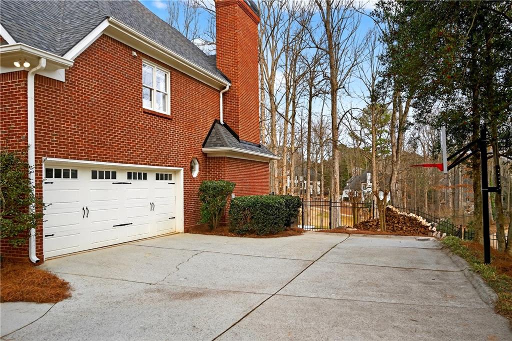 14325 Morning Mountain Way Milton, GA 30004 - Photo 57 of 66 a front view of a house with a yard