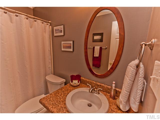 4405 Ennismore Circle Raleigh, NC 27613 - Photo 17 of 21 Bathroom with new fixtures and granite counter top.