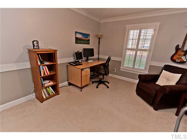 4405 Ennismore Circle Raleigh, NC 27613 - Photo 18 of 21 Secondary bedroom with plantation shutter.