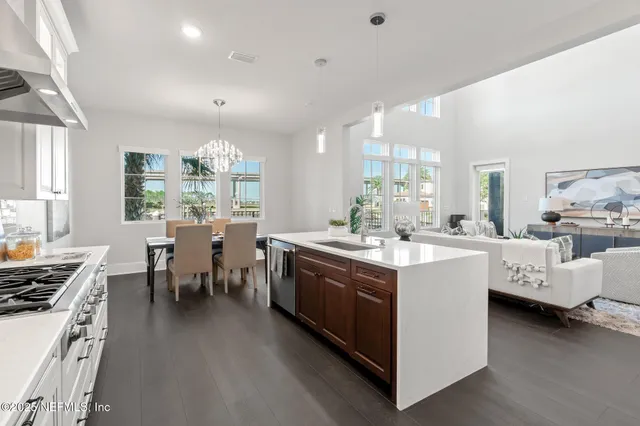 a utility room with sink dryer and washer