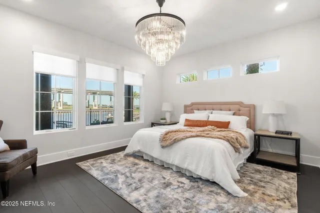 a white bath tub sitting in a bathroom next to a window