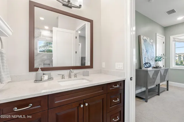 en empty room with ceiling fan and window