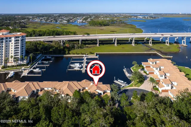 an aerial view of a house with a lake view