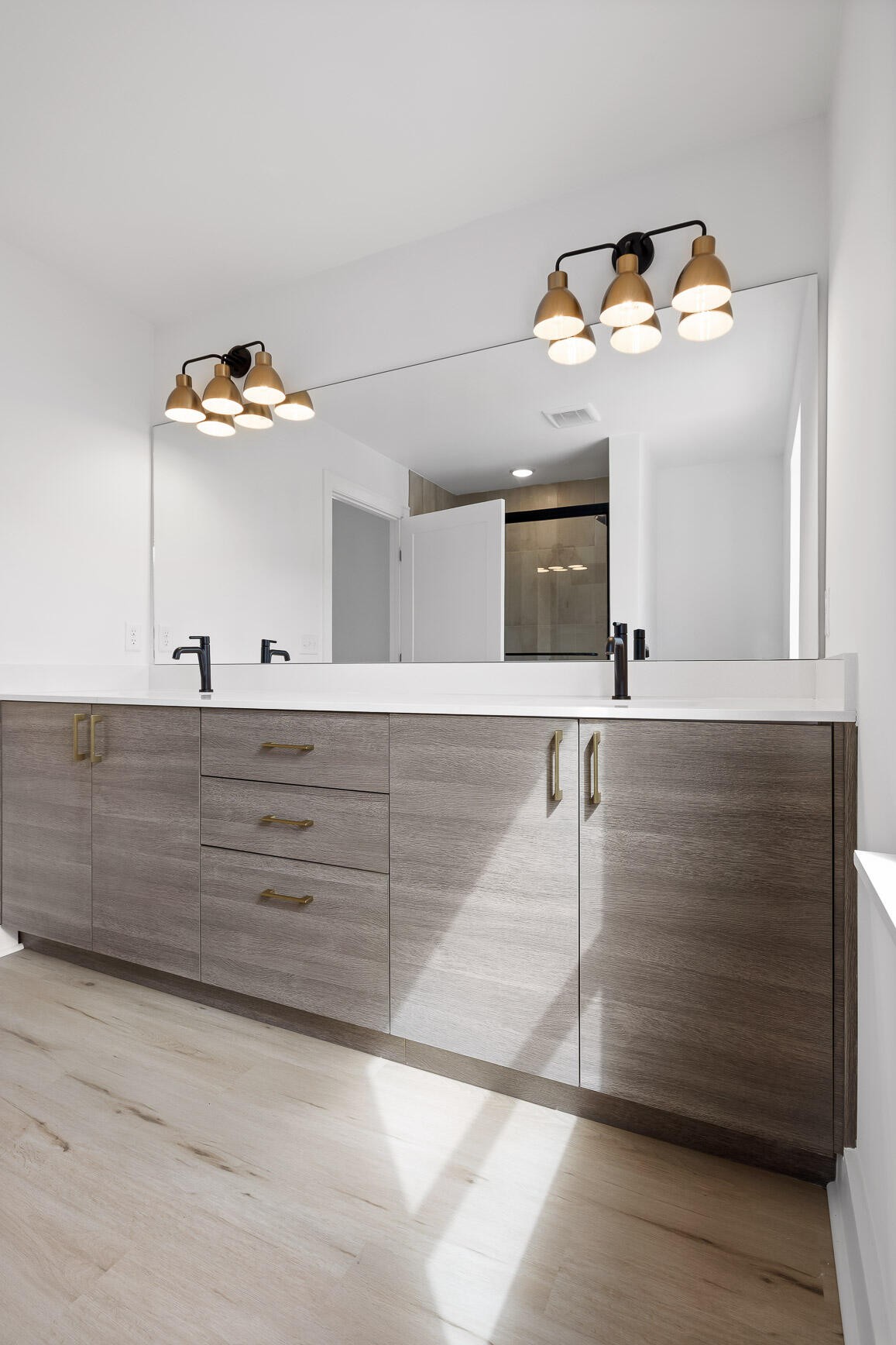 1847 Coosa Way Chattanooga, TN 37404 - Photo 31 of 52 a bathroom with a sink a mirror and a light fixture