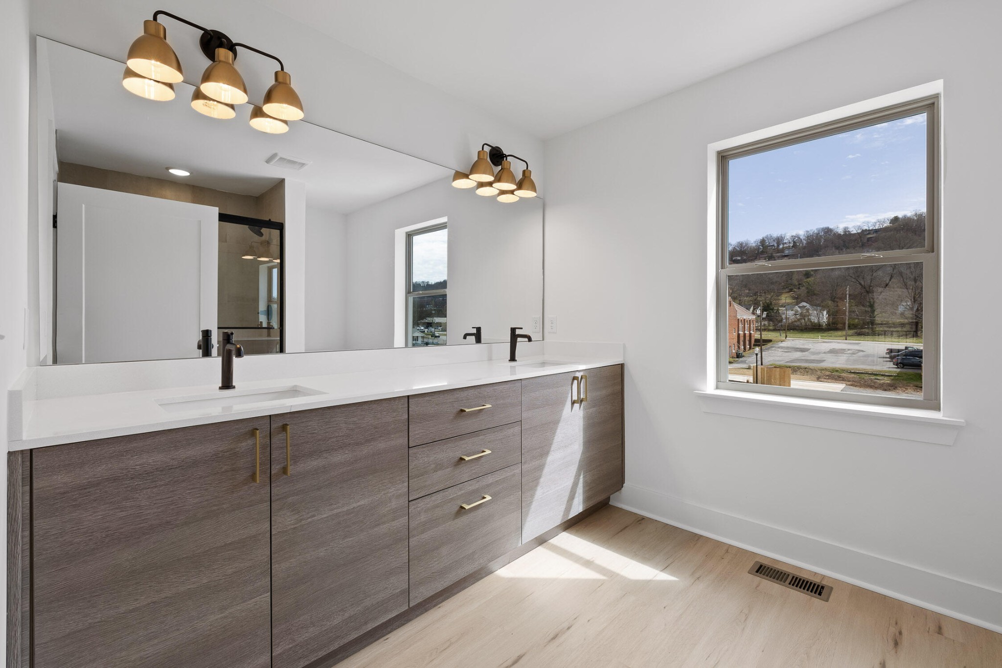 1847 Coosa Way Chattanooga, TN 37404 - Photo 32 of 52 a bathroom with a double vanity sink and a mirror