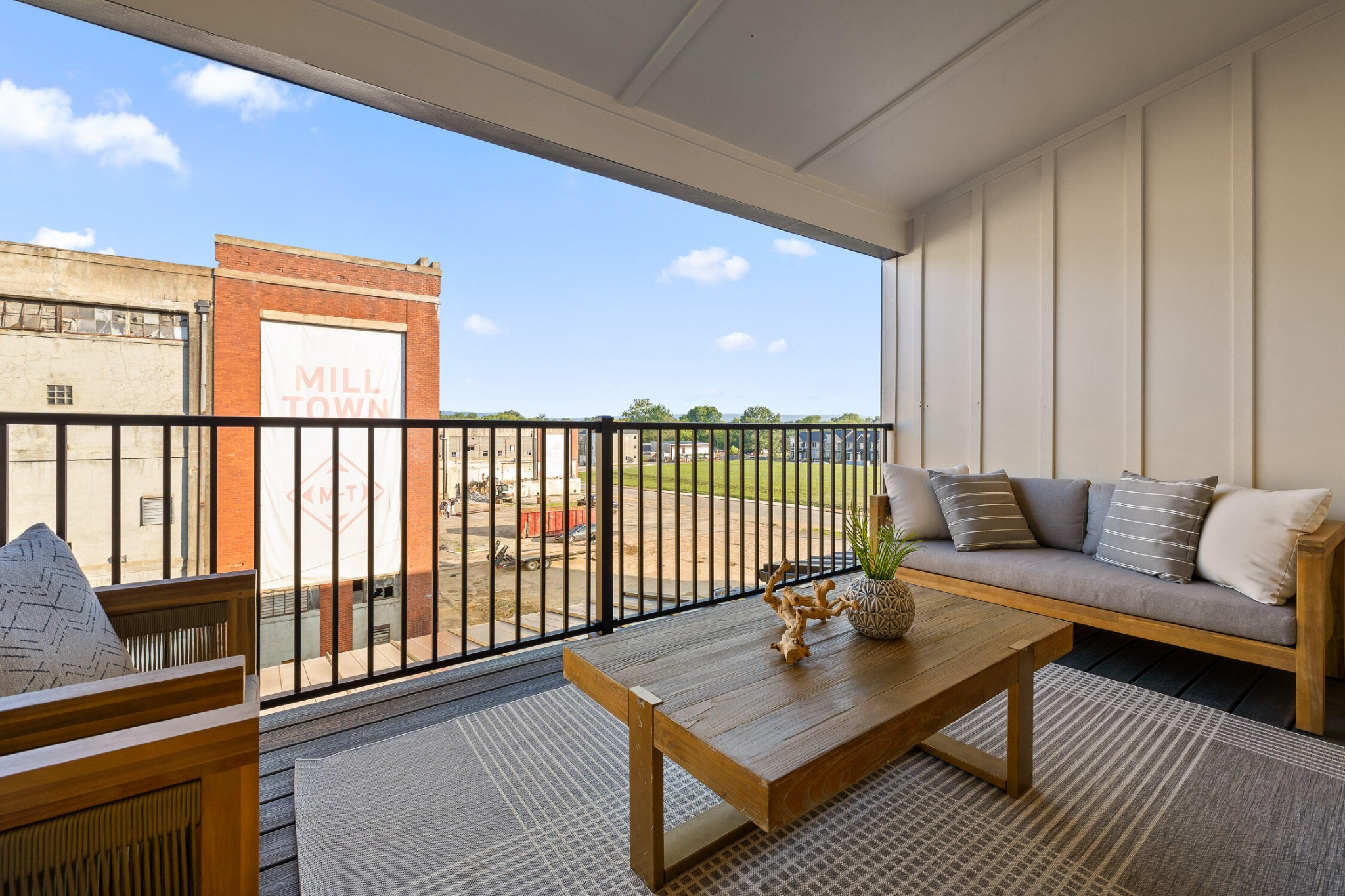 1847 Coosa Way Chattanooga, TN 37404 - Photo 38 of 52 a living room with a couch a table and a large window