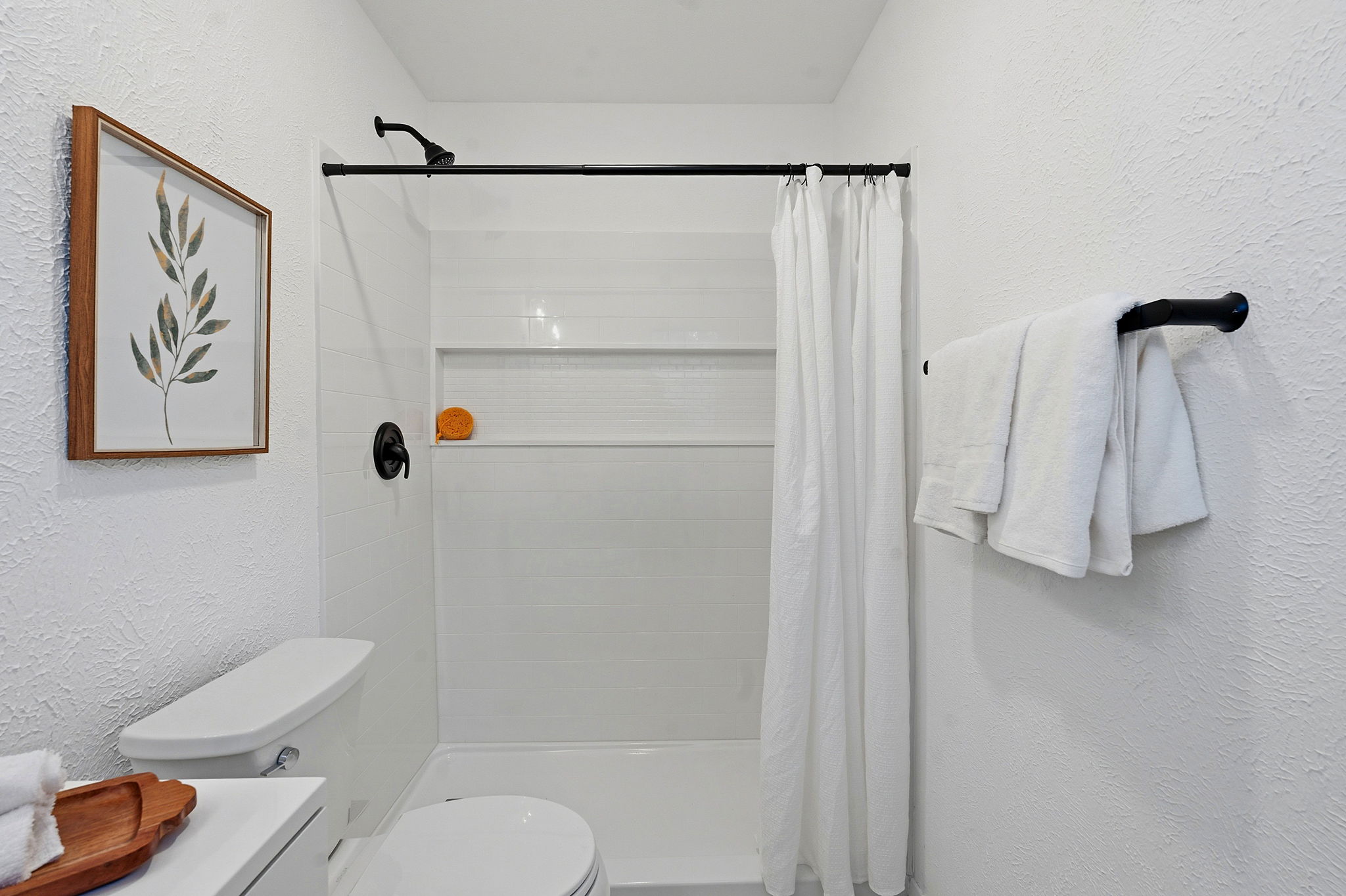 2702 Calabash Cove Austin, TX 78745 - Photo 32 of 40 a bathroom with a shower a toilet and a shower