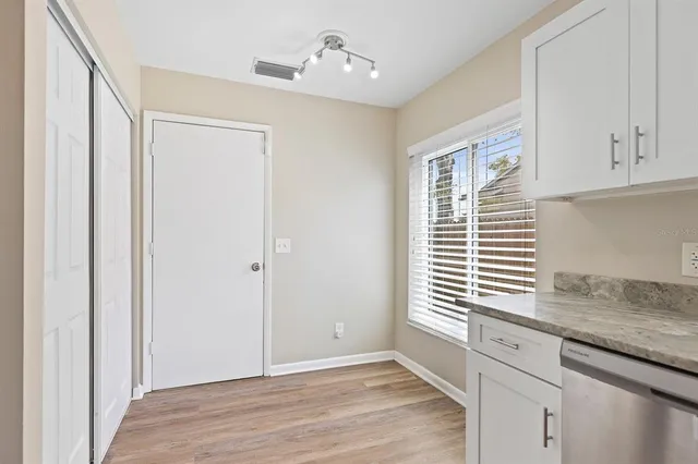 a view of cabinets and window