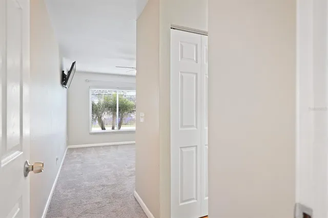 a view of a hallway with windows