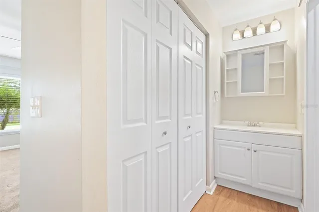 a bathroom with a sink a mirror and a shower