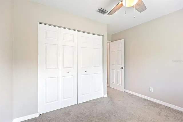 an empty room with a empty space and windows