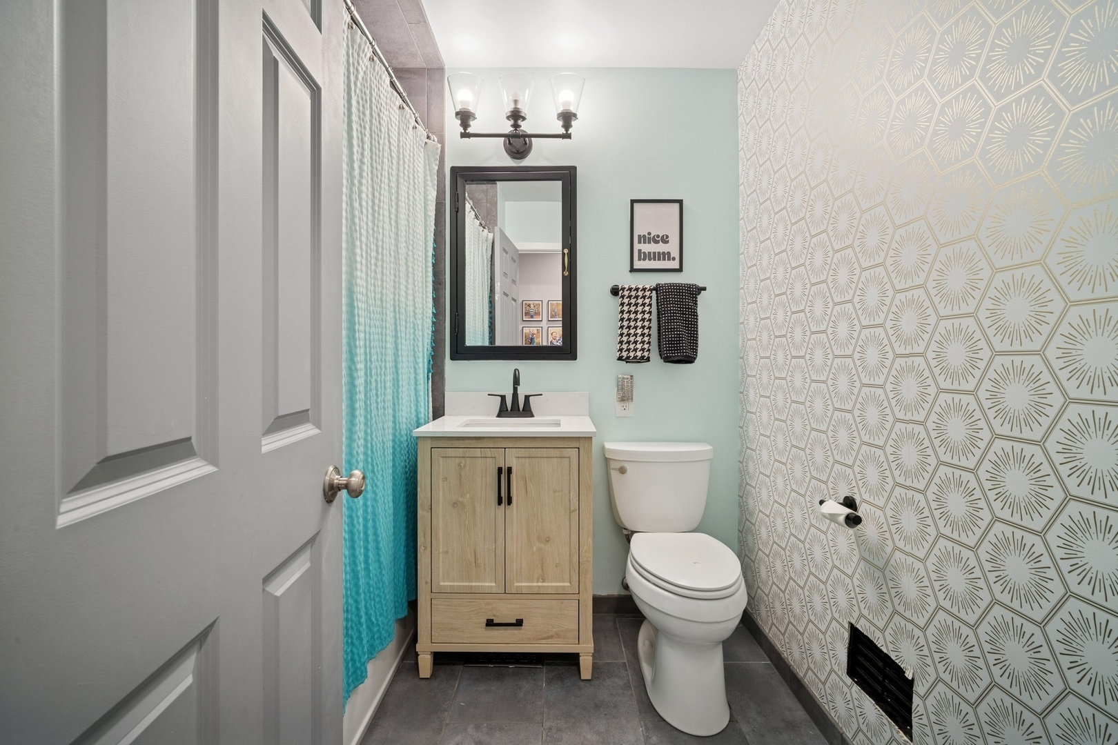 505 Pine Court Lake Bluff, IL 60044 - Photo 18 of 29 a bathroom with a toilet sink and mirror