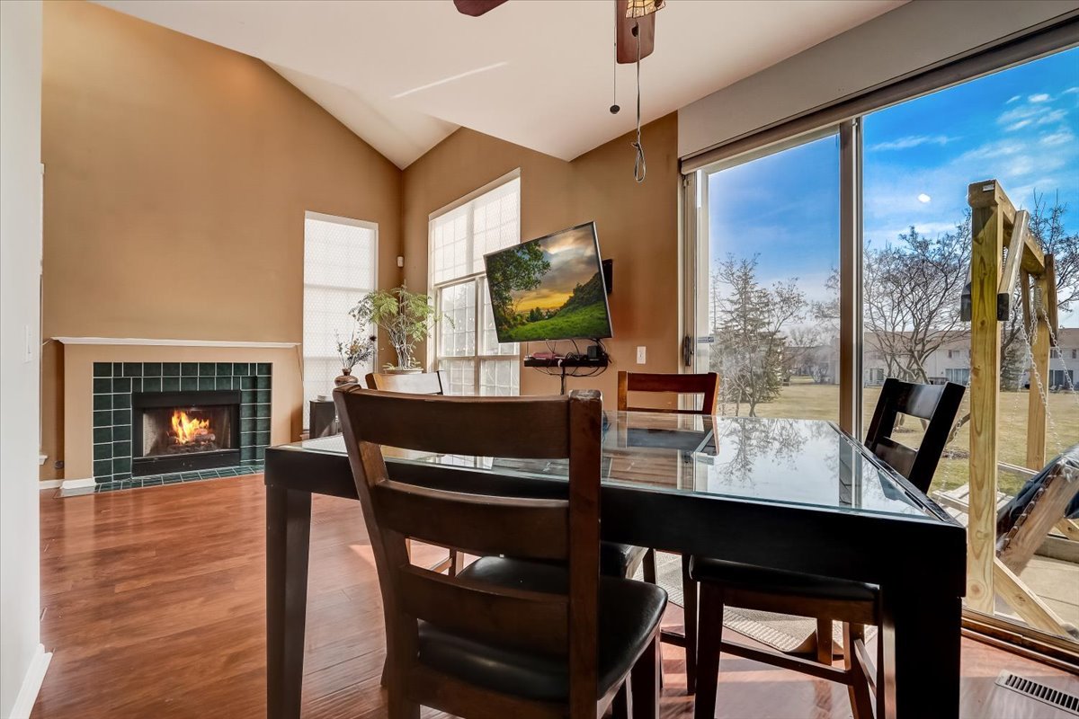 17885 Braewick Road, Unit 17217 Gurnee, IL 60031 - Photo 11 of 35 a living room with furniture and a flat screen tv