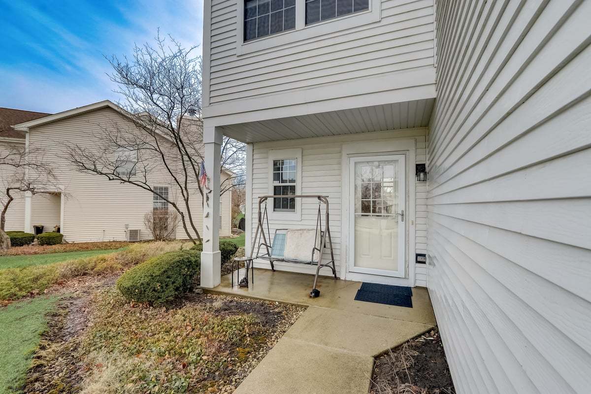 17885 Braewick Road, Unit 17217 Gurnee, IL 60031 - Photo 4 of 35 a house view with a backyard space
