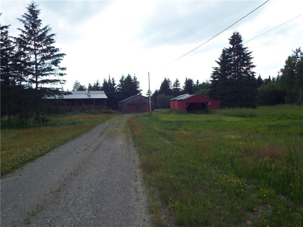 636 Westmanland Road Stockholm, ME 04783 - Photo 1 of 13 Long driveway. Barn to the left of...
