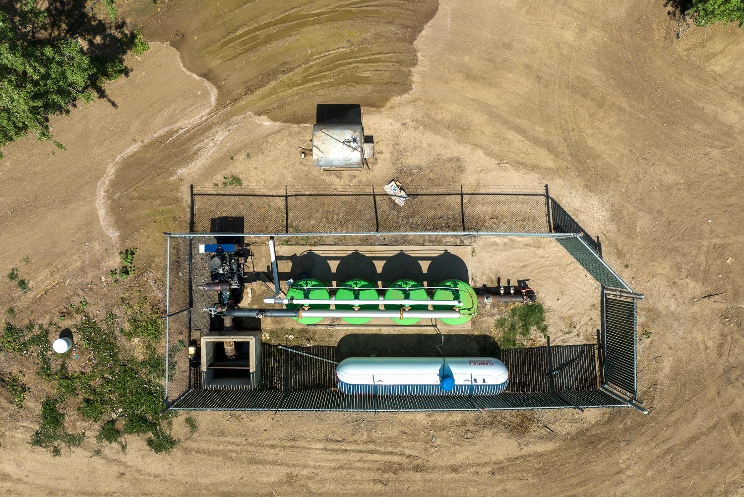 100 Draper Road Gustine, CA 95322 - Photo 2 of 24 a room with lots of wooden furniture and a potted plant