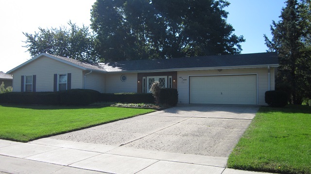 208 Linder Lane Rochelle, IL 61068 - Photo 1 of 25 a front view of a house with a yard and garage