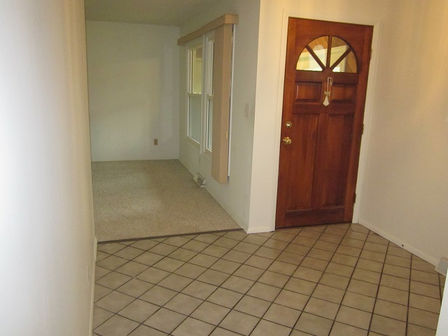 208 Linder Lane Rochelle, IL 61068 - Photo 2 of 25 an empty room with windows