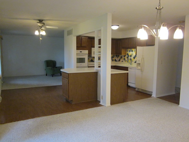 208 Linder Lane Rochelle, IL 61068 - Photo 6 of 25 a kitchen with stainless steel appliances a refrigerator and a stove top oven